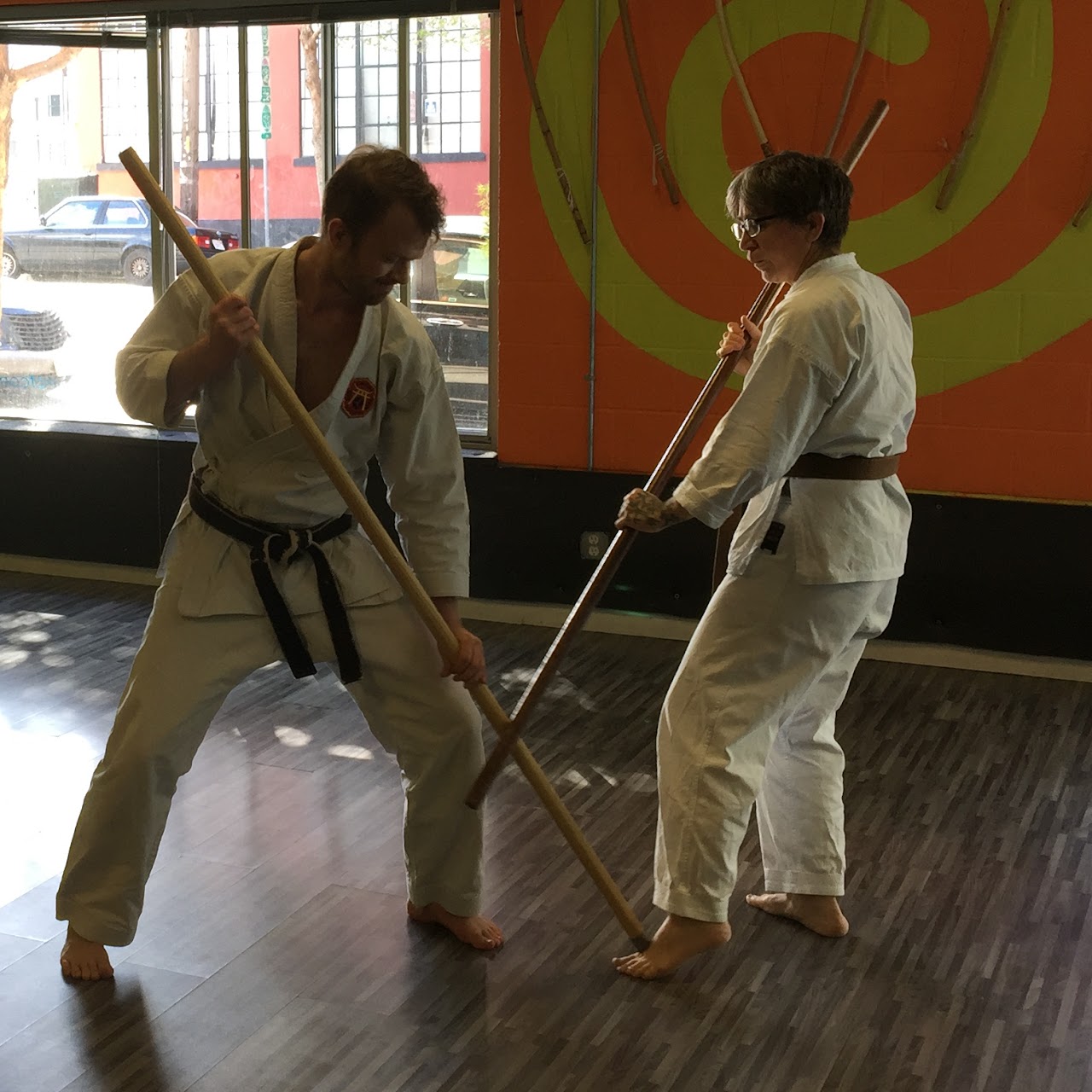 Partners practicing kobudo weapons