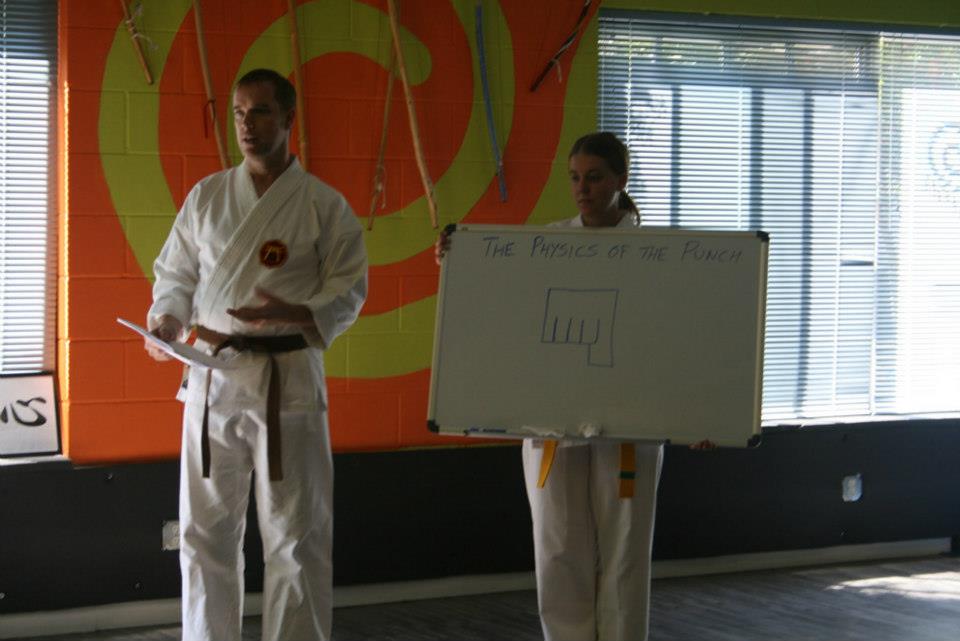 Instructors teaching the physics of the punch