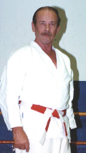 Walter Todd Sensei standing in a white gi